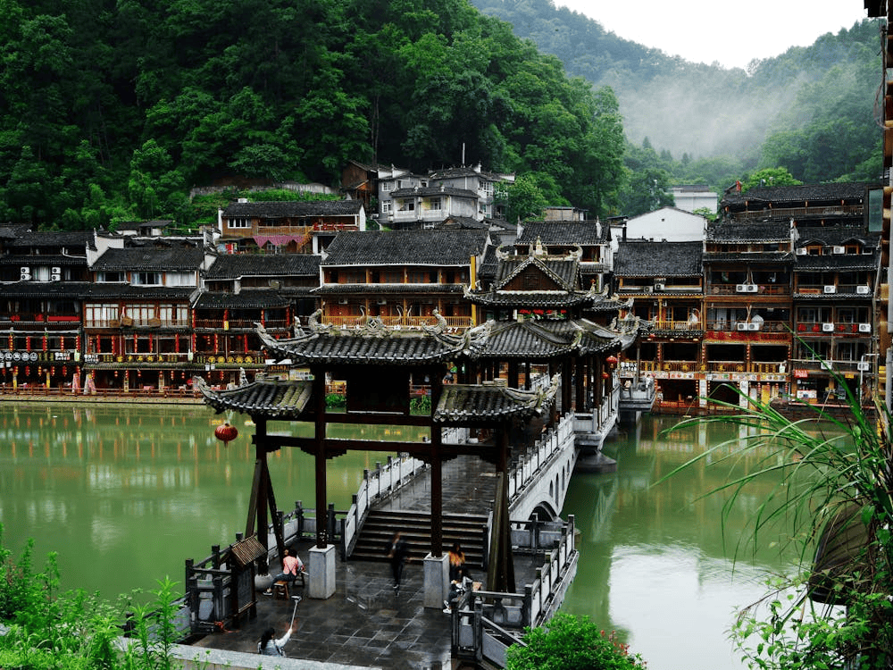 The morning mist adds a dreamlike charm to this timeless riverside village (Source: Pexels)